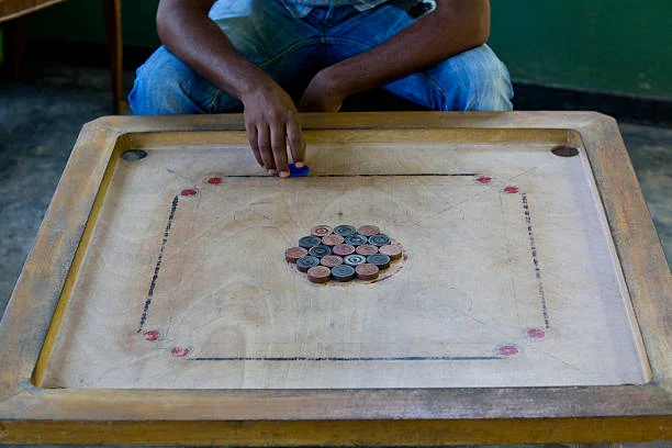 hitting in the carrom pieces