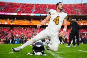 Derek Carr of New Orleans Saints warms up before kickoff against the Kansas City Chiefs.