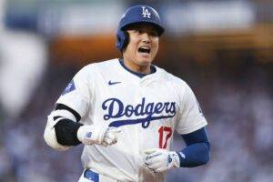 Shohei Ohtani of the Los Angeles Dodgers celebrates a three run home run