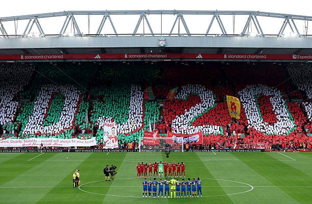 Players, match officials and fans take part in a minute's silence as a fan mosaic depicting "DJ20" is displayed in memory of Diogo Jota and his brother Andre Silva prior to the Premier League match between Liverpool and Bournemouth at Anfield.
